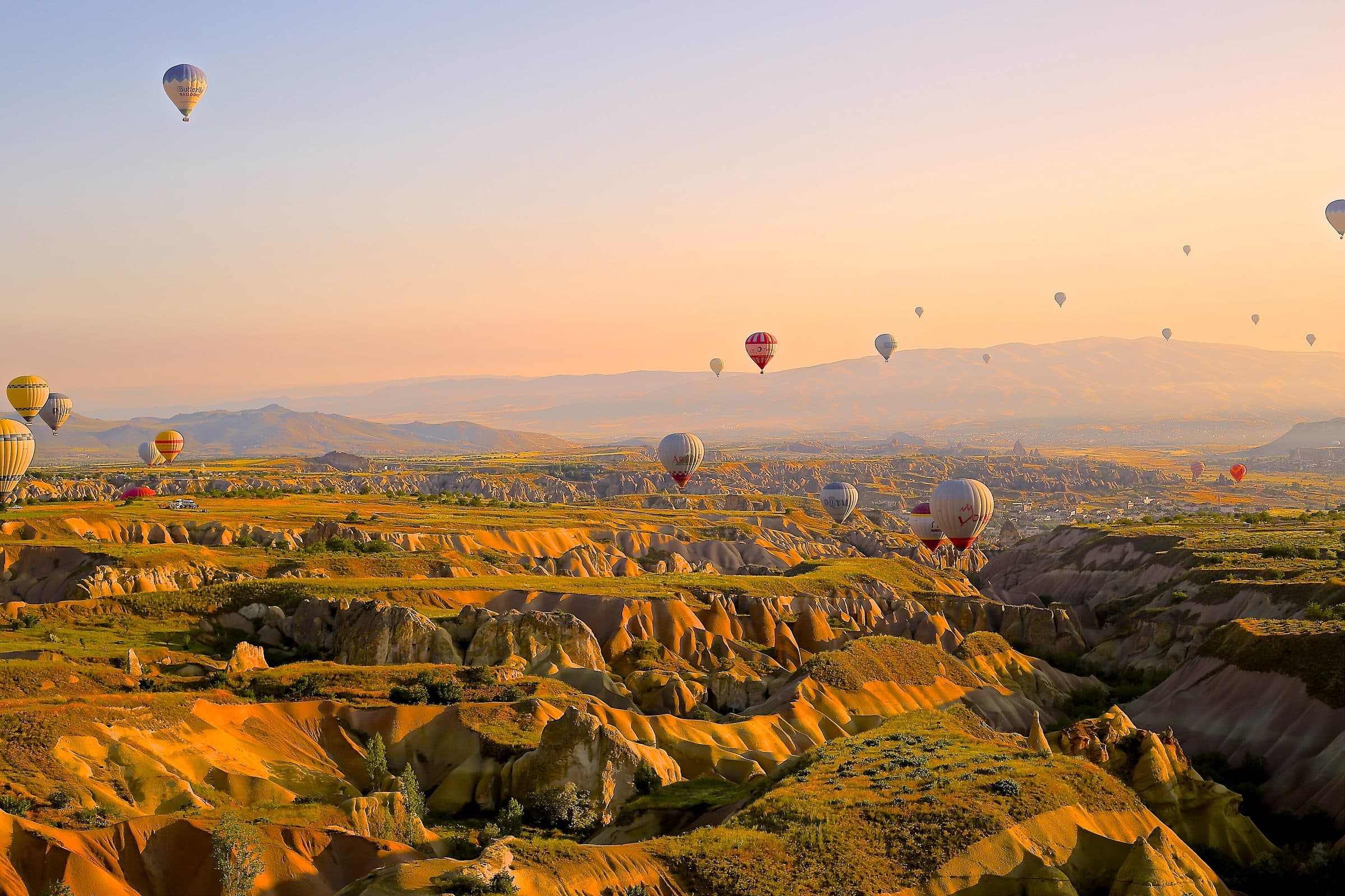 Hot air balloons over Cappadocia at sunrise